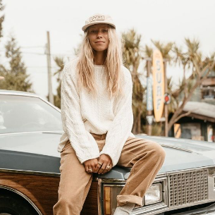 women sitting on car clothing display
